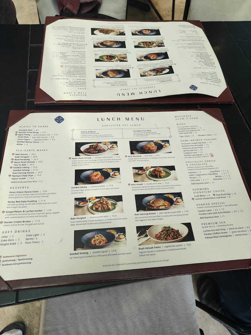 A detailed view of Godmama's lunch and ala-carte menus, showcasing Peranakan dishes and beverages.