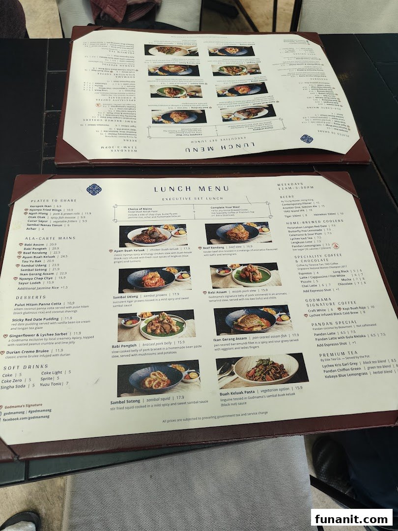 A detailed view of Godmama's lunch and ala-carte menus, showcasing Peranakan dishes and beverages.