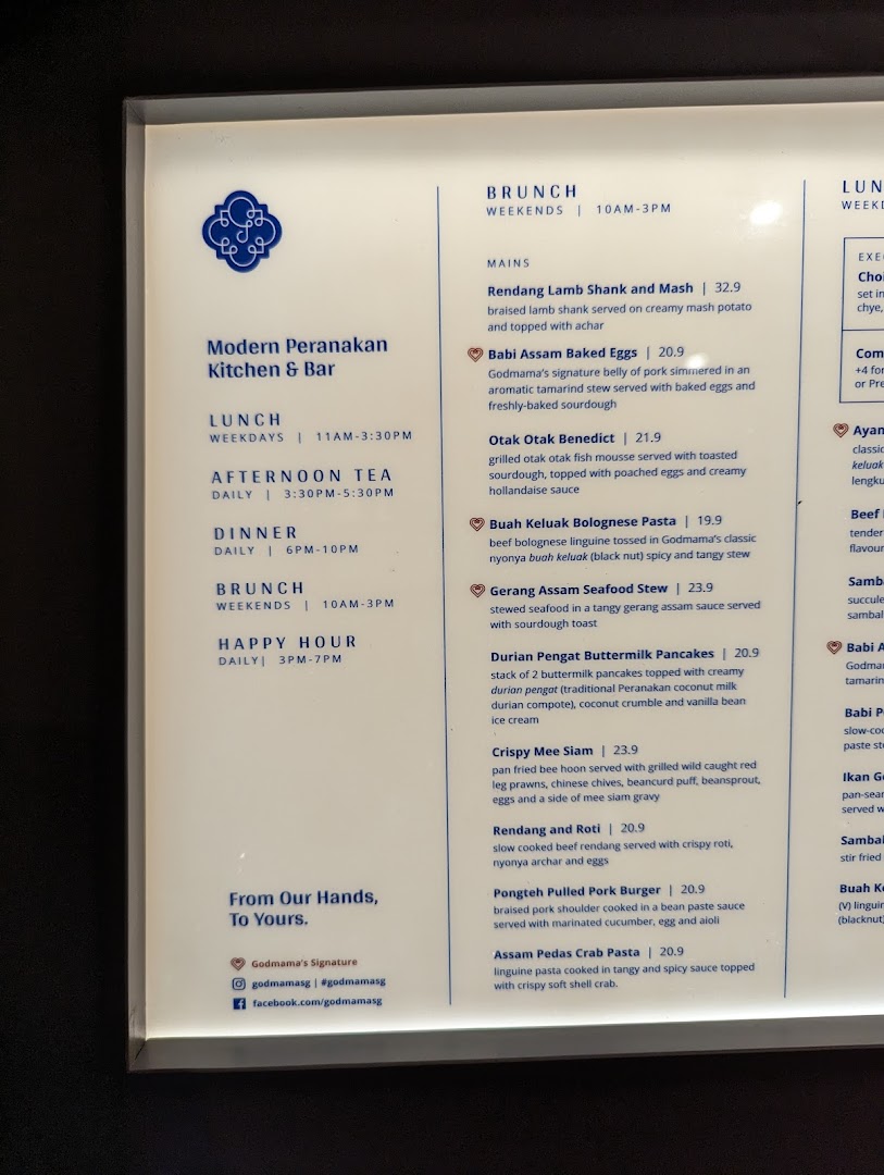 A detailed menu board displaying brunch, lunch, afternoon tea, and dinner offerings with prices.