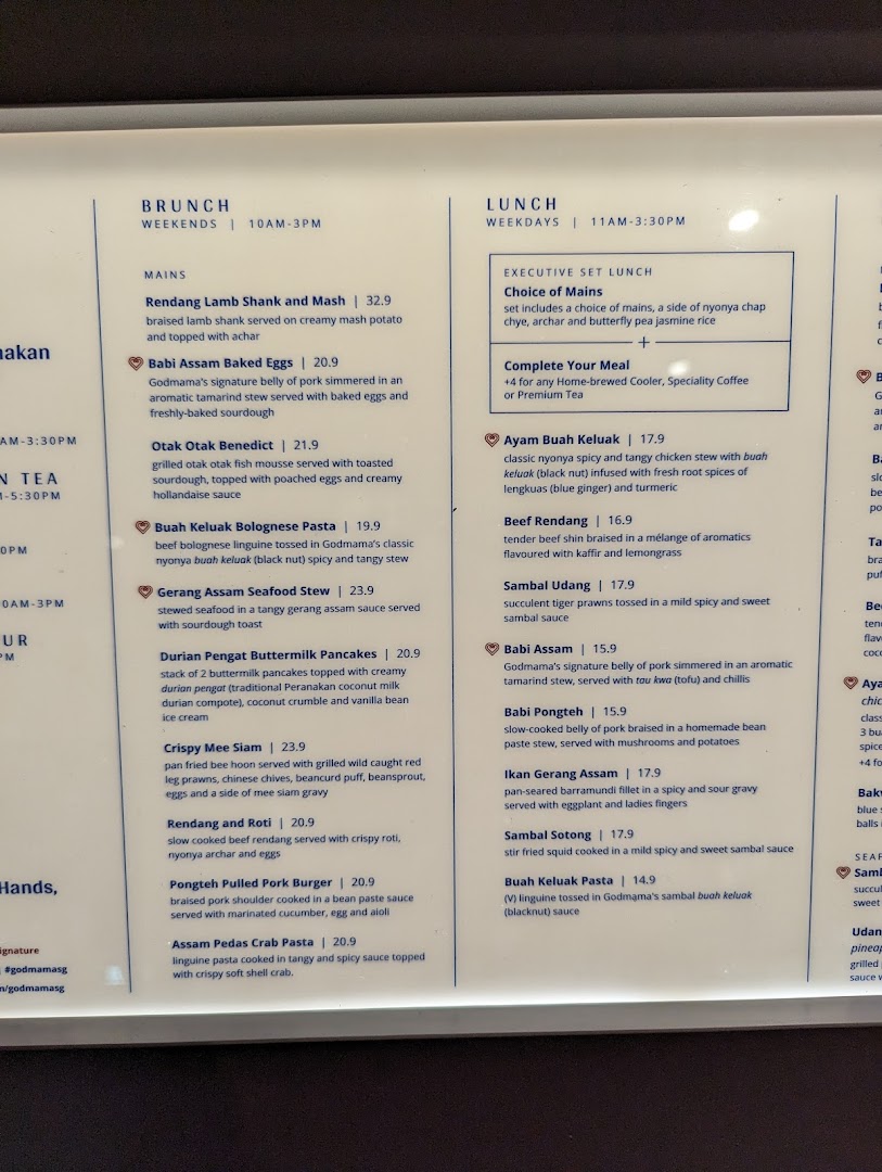 A detailed menu board displaying brunch and lunch offerings with prices and descriptions.