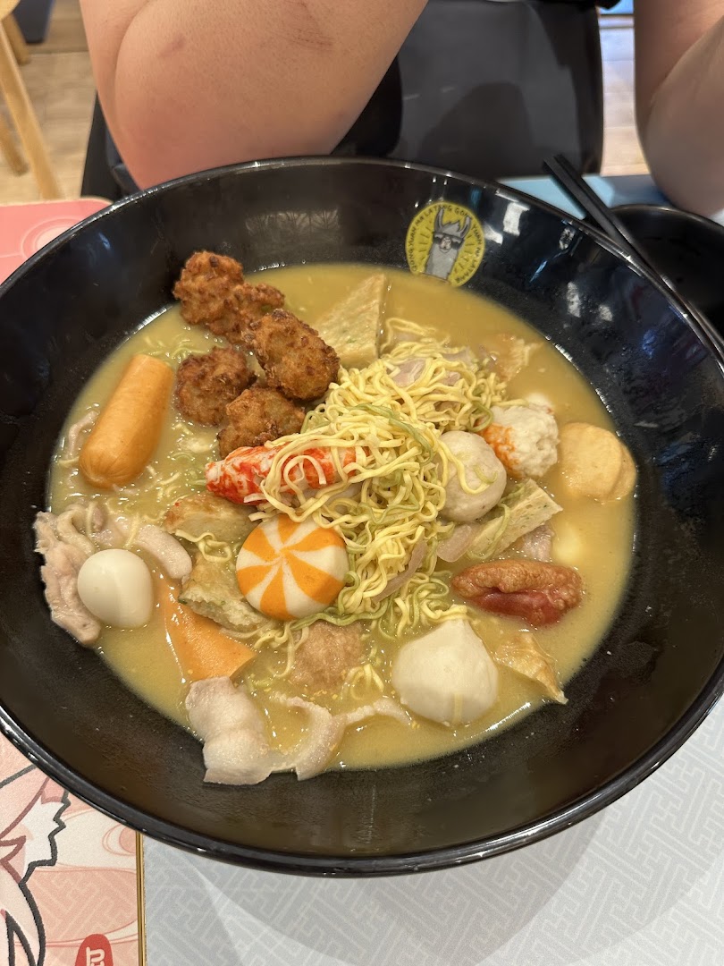 A close-up of a large bowl of flavorful Mala Tang with various ingredients and noodles.