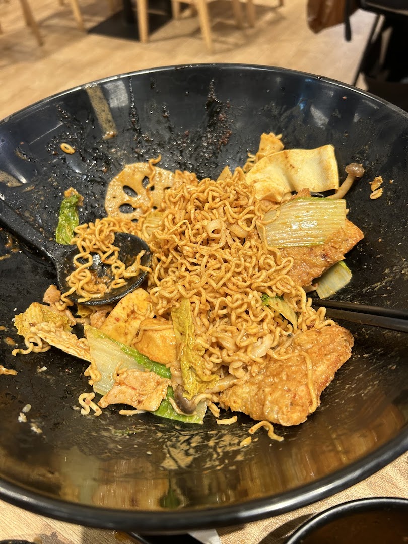 A close-up of a delicious bowl of Mala Tang with instant noodles, vegetables, and other ingredients.