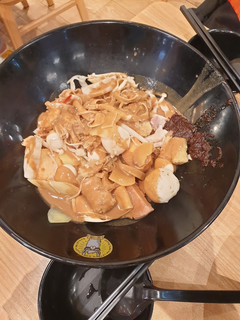 A close-up of a large bowl of customizable Mala Tang with various ingredients and rich sauce.