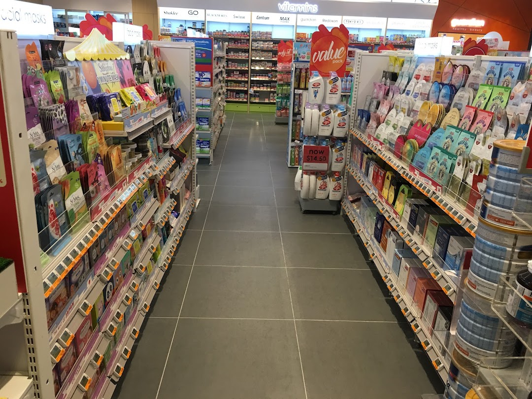 An interior view of Guardian Health & Beauty, showcasing aisles filled with health and beauty products.