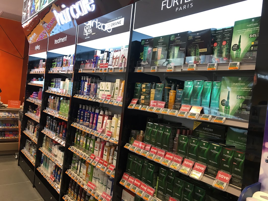 Shelves filled with a wide range of hair care and beauty products, including items from Furterer.
