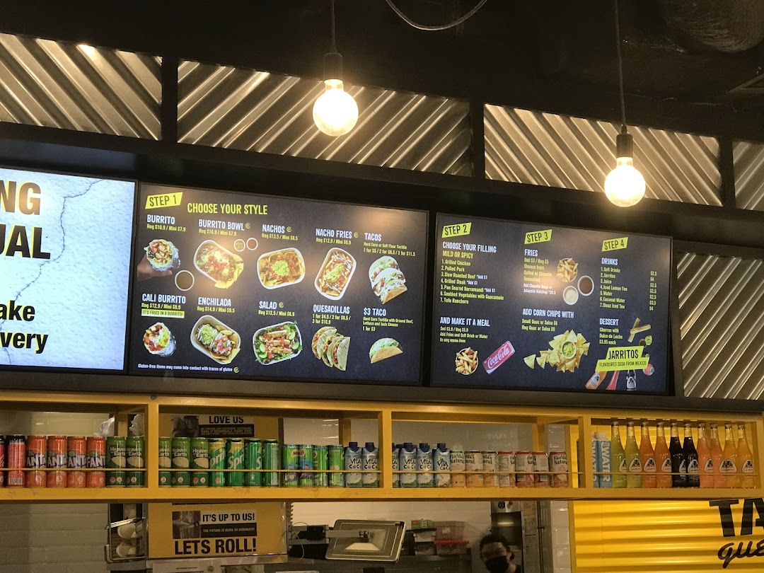 A digital menu board displaying various Mexican food options and prices at Guzman y Gomez.