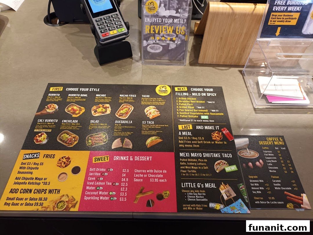 A detailed menu display at Guzman y Gomez, showcasing food, drinks, and dessert options.