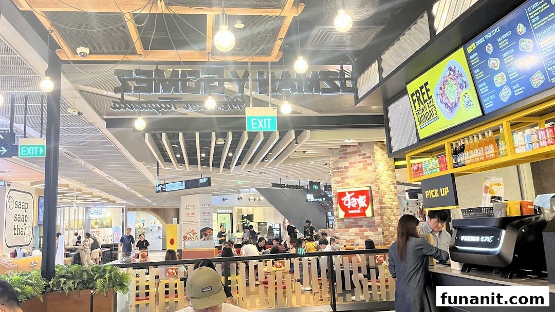 A vibrant interior shot of Guzman y Gomez, showcasing its menu board and dining area.