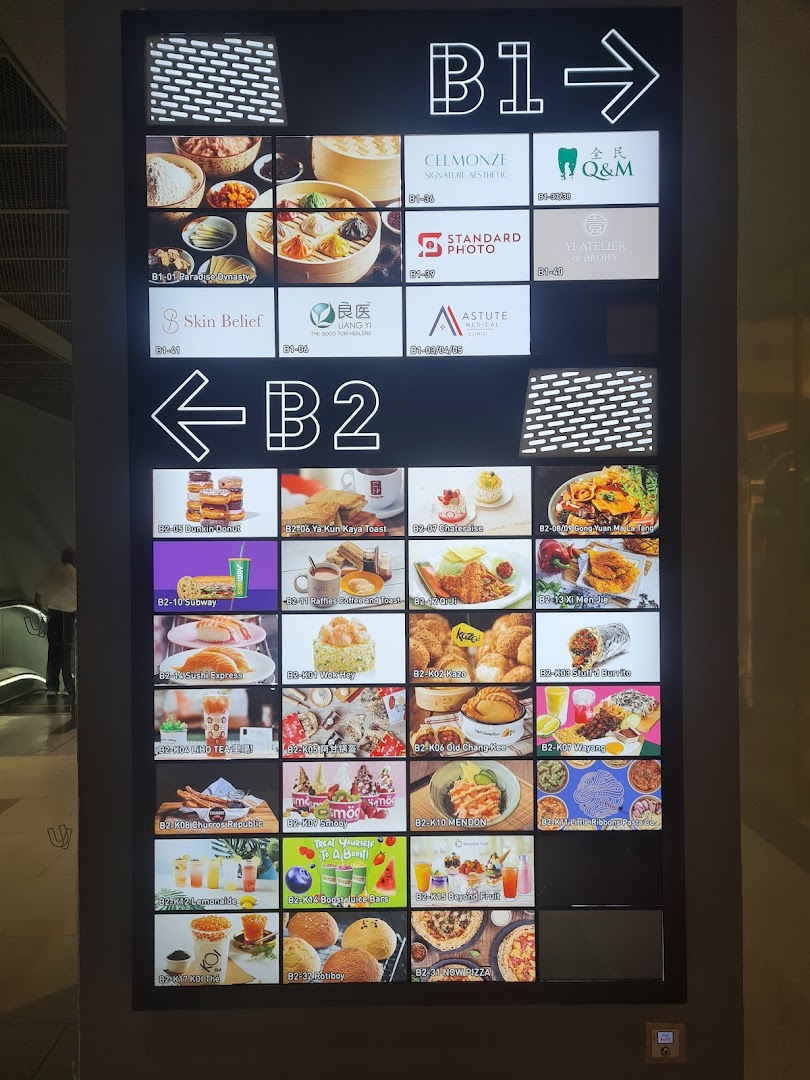 A digital directory board showing retail and F&B outlets on B1 and B2 levels.