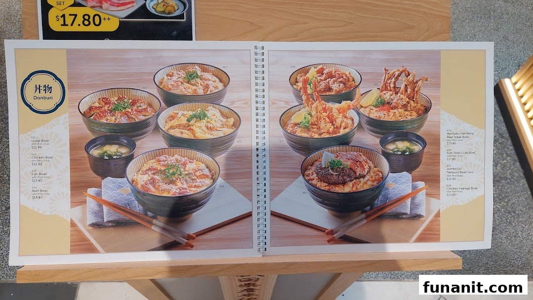 A menu display showcasing various Japanese Donburi rice bowls with different toppings.