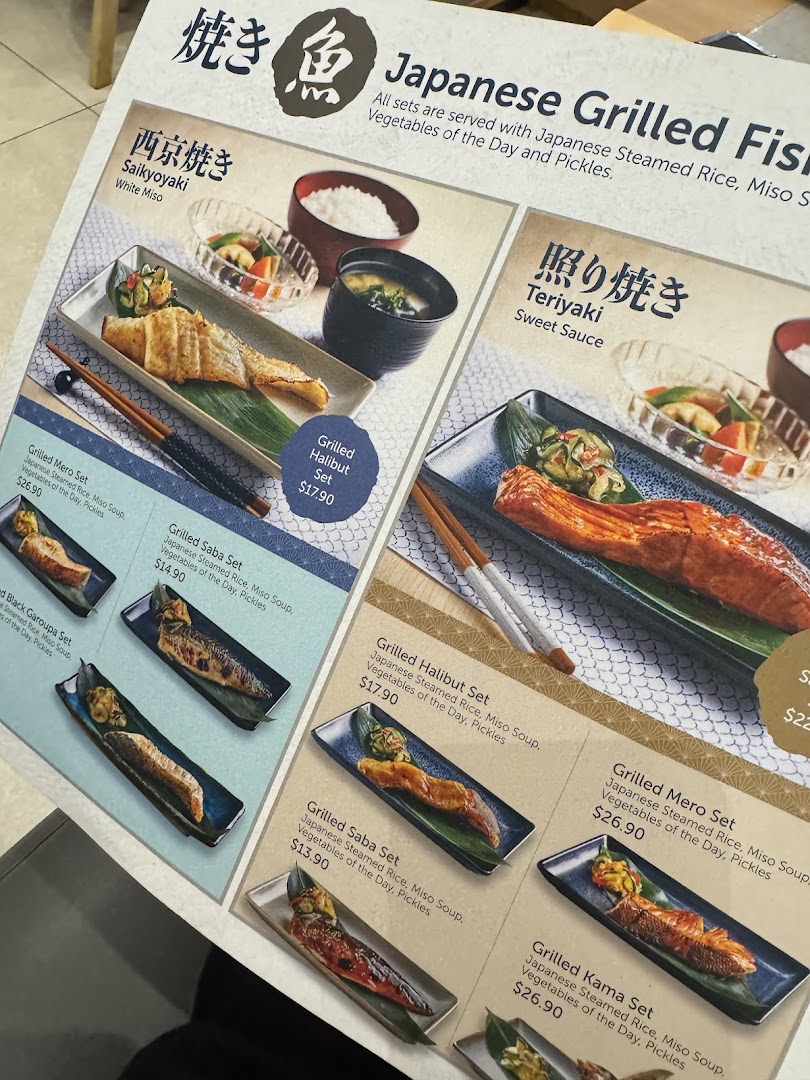 A close-up view of a Japanese grilled fish menu featuring Saikyoyaki and Teriyaki sets.