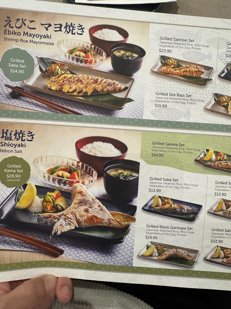 A close-up view of GyoGyo's menu featuring various Japanese grilled fish sets.