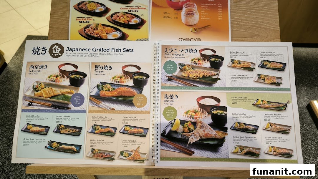 An open menu displaying various Japanese grilled fish sets with descriptions and prices.