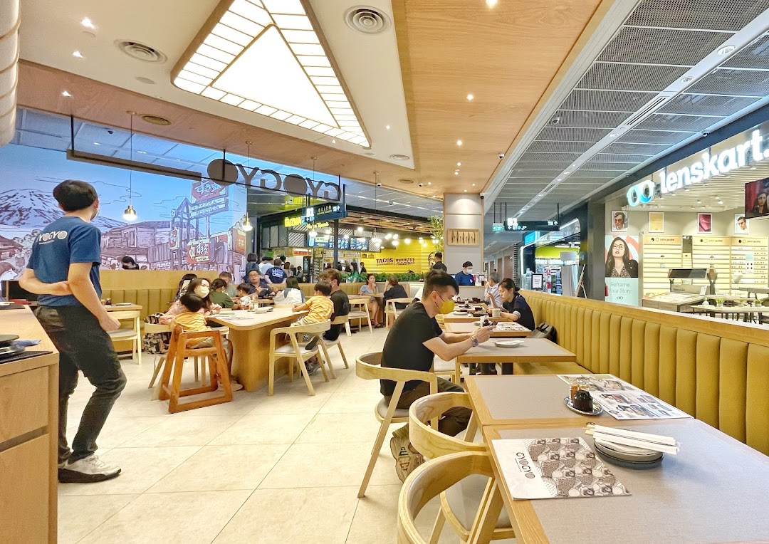 Diners enjoying meals inside GyoGyo Japanese Grilled Fish Sukiyaki restaurant at Funan Mall.