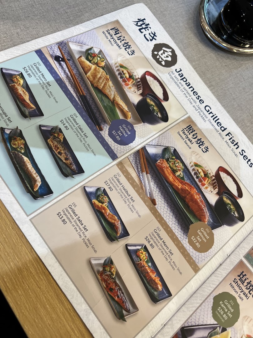 A detailed menu page showcasing various Japanese grilled fish sets with prices and descriptions.