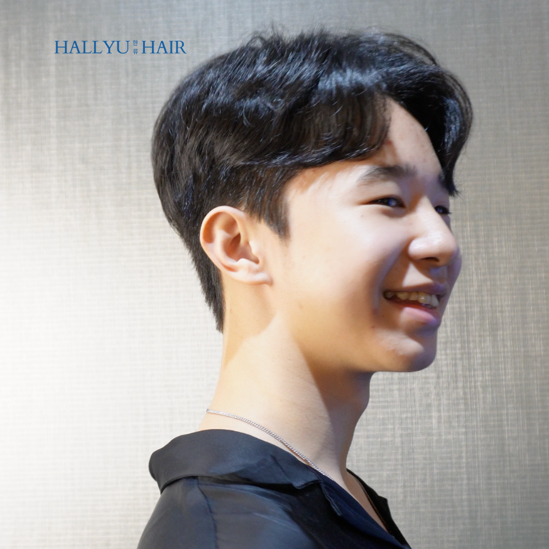 A young man with a stylish, modern Korean-inspired haircut, showcasing Hallyu Hair's expertise.