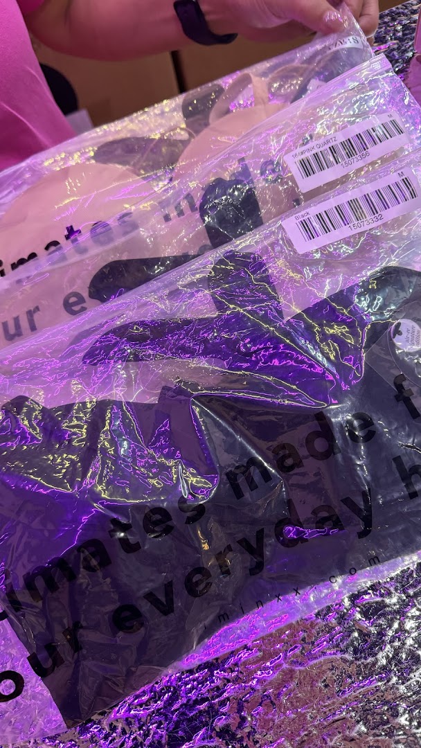 Close-up of IM IN IMINXX intimate wear in clear packaging, showing product details and colors.
