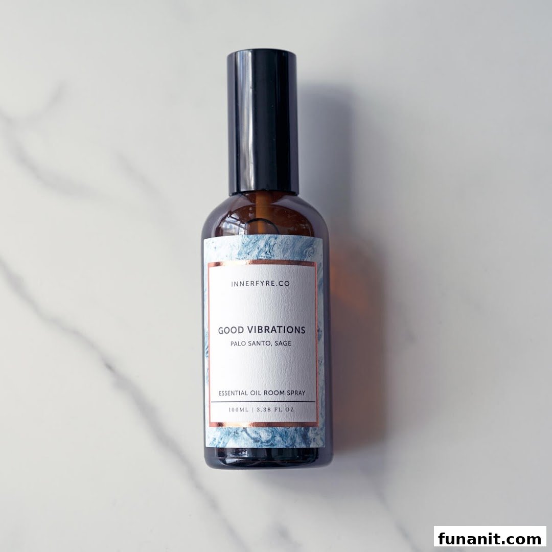 A bottle of Innerfyre Co's 'Good Vibrations' essential oil room spray on a marble surface.