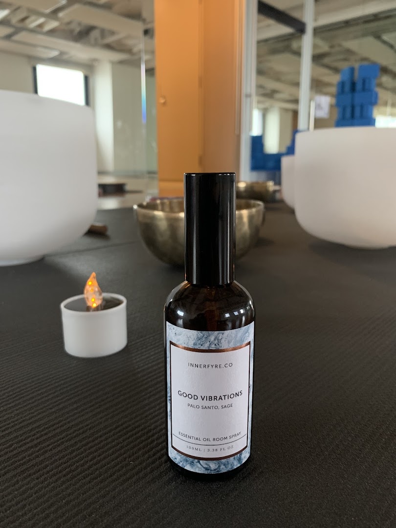 A bottle of Innerfyre Co's 'Good Vibrations' essential oil room spray with singing bowls.
