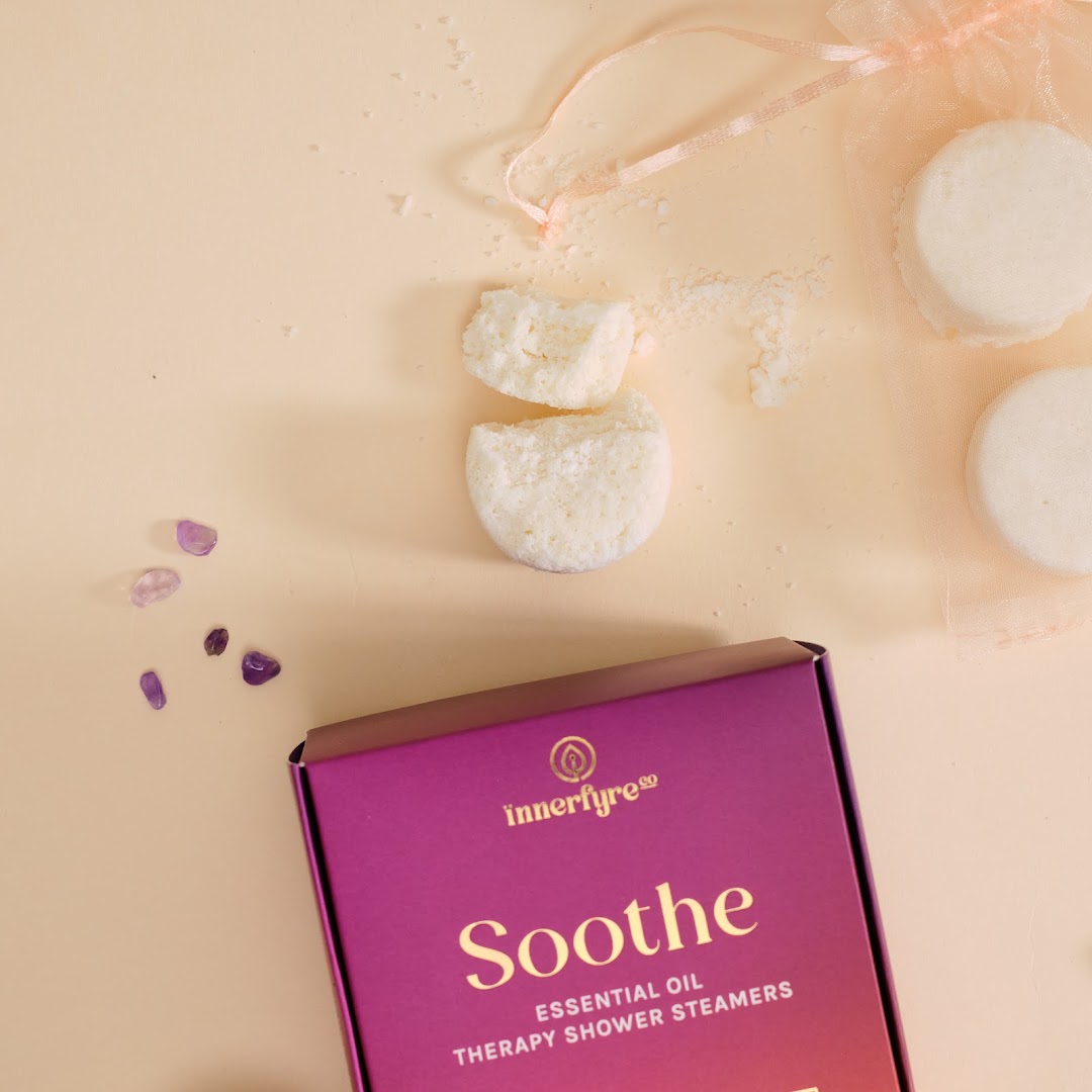 Innerfyre Co's 'Soothe' essential oil therapy shower steamers with packaging and crystals.
