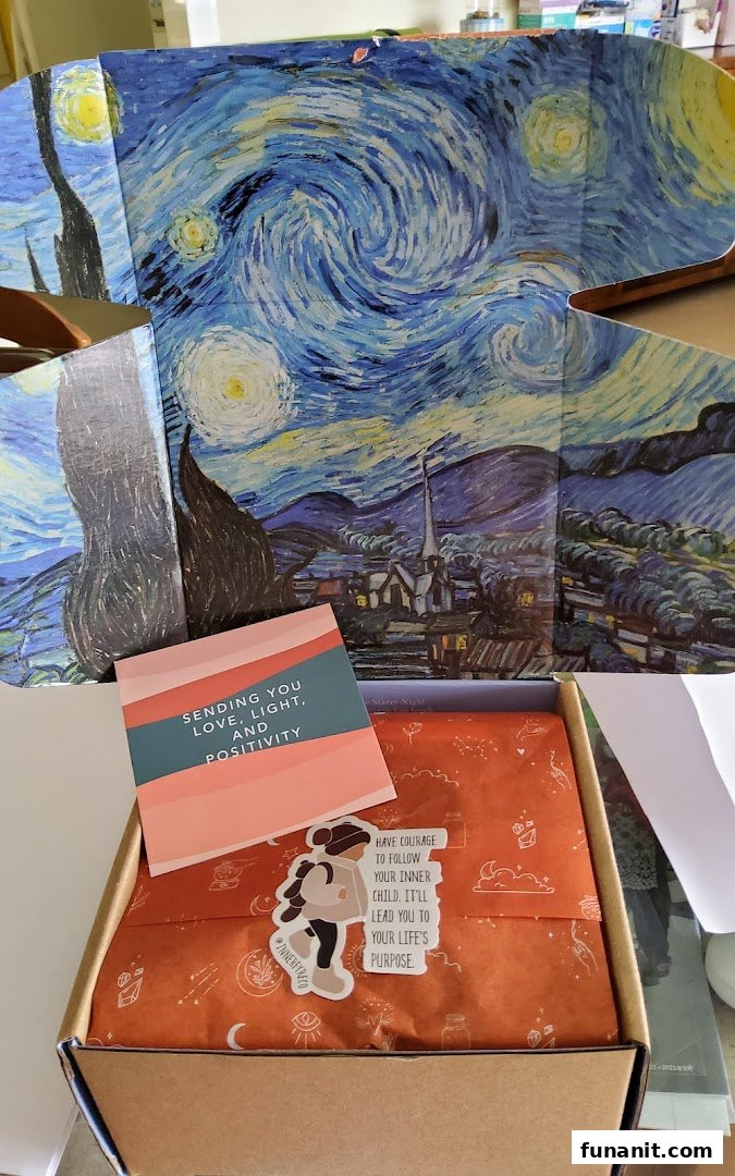 An open Innerfyre Co box with a "Starry Night" lid, a positive message card, and a sticker.