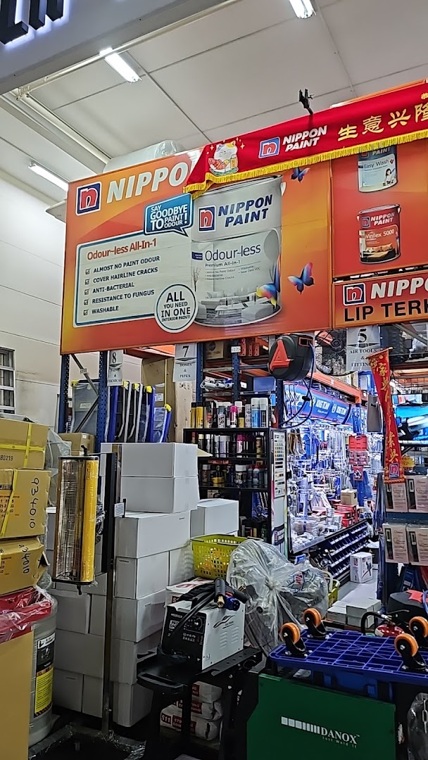 Interior view of a hardware store, featuring prominent Nippon Paint displays and various tools.