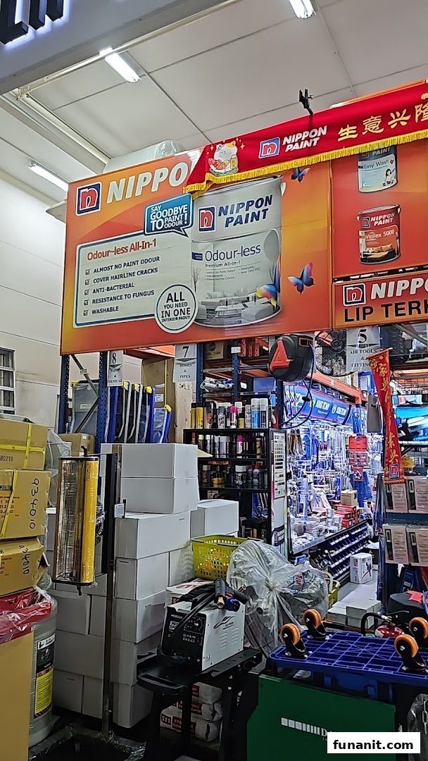 Interior view of a hardware store, featuring prominent Nippon Paint displays and various tools.
