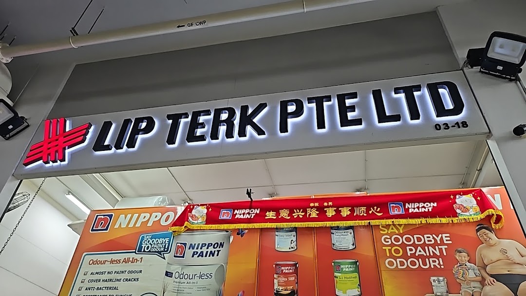 The illuminated shop sign for LIP TERK PTE LTD, featuring a Nippon Paint display.