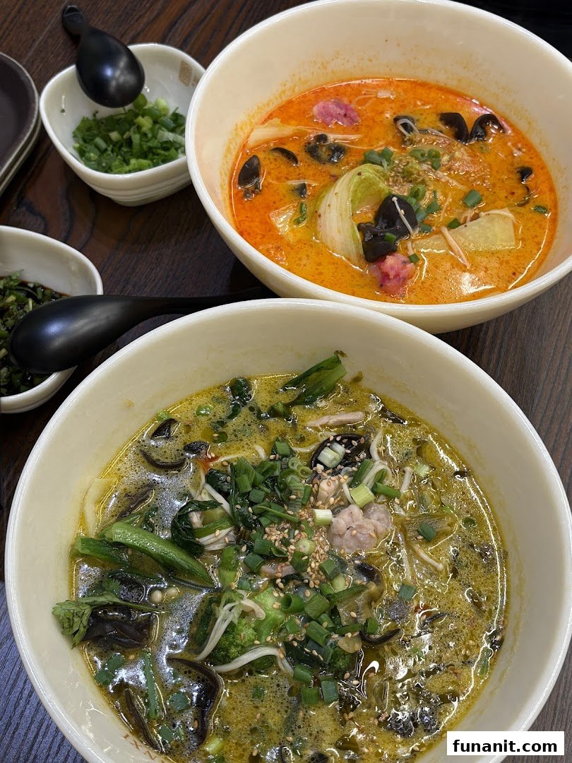 Two vibrant bowls of delicious noodles or soup, one red and one green, served with various toppings.