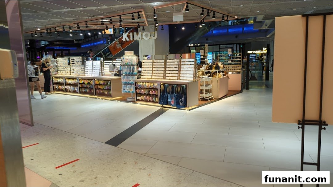 The KIMOJ shop interior showcasing displays of trendy accessories, eyewear, and small items.
