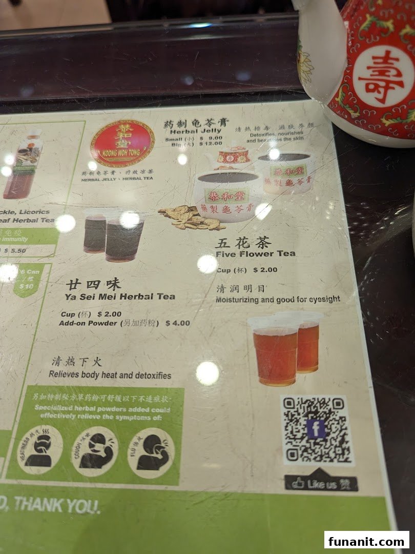 A close-up view of Koong Woh Tong's menu featuring traditional herbal jelly and teas.