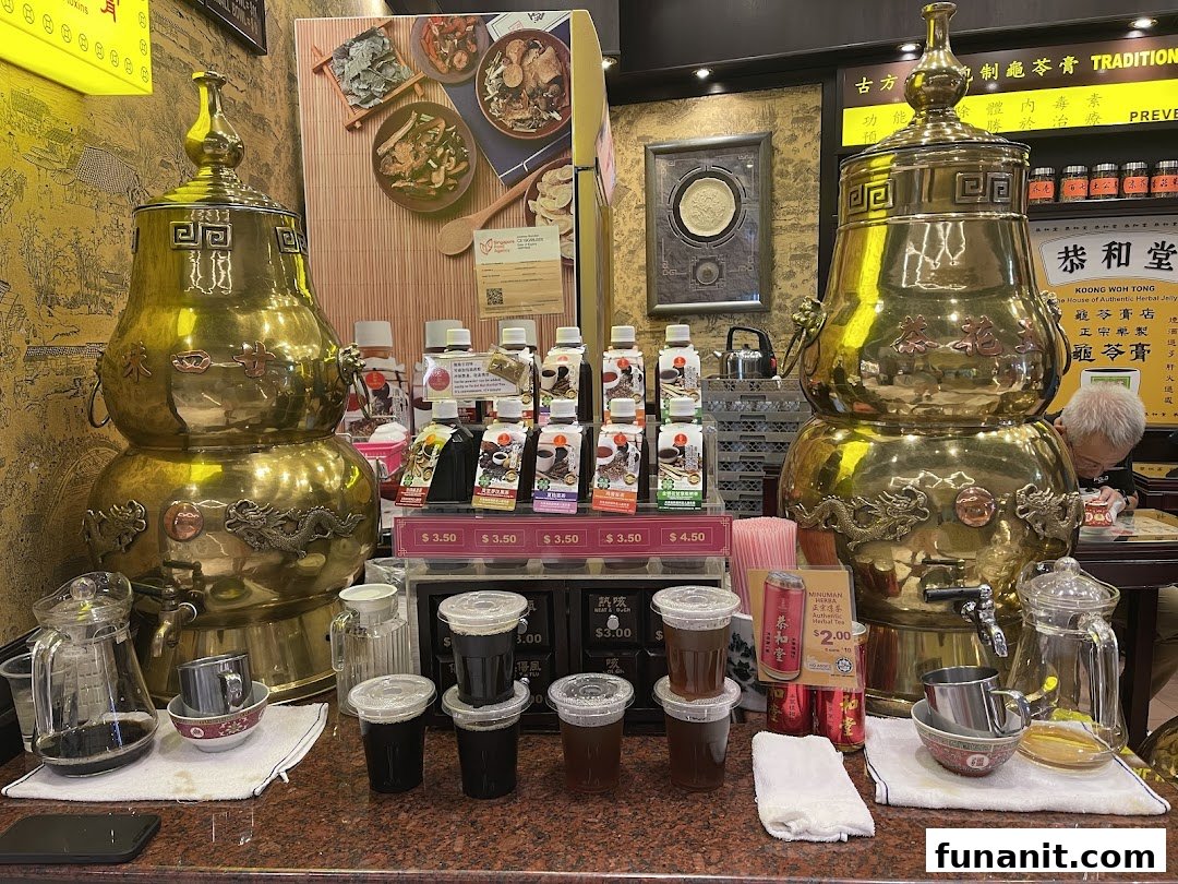 Traditional brass dispensers and various herbal remedies, including bottled drinks and jelly, are displayed at Koong Woh Tong.