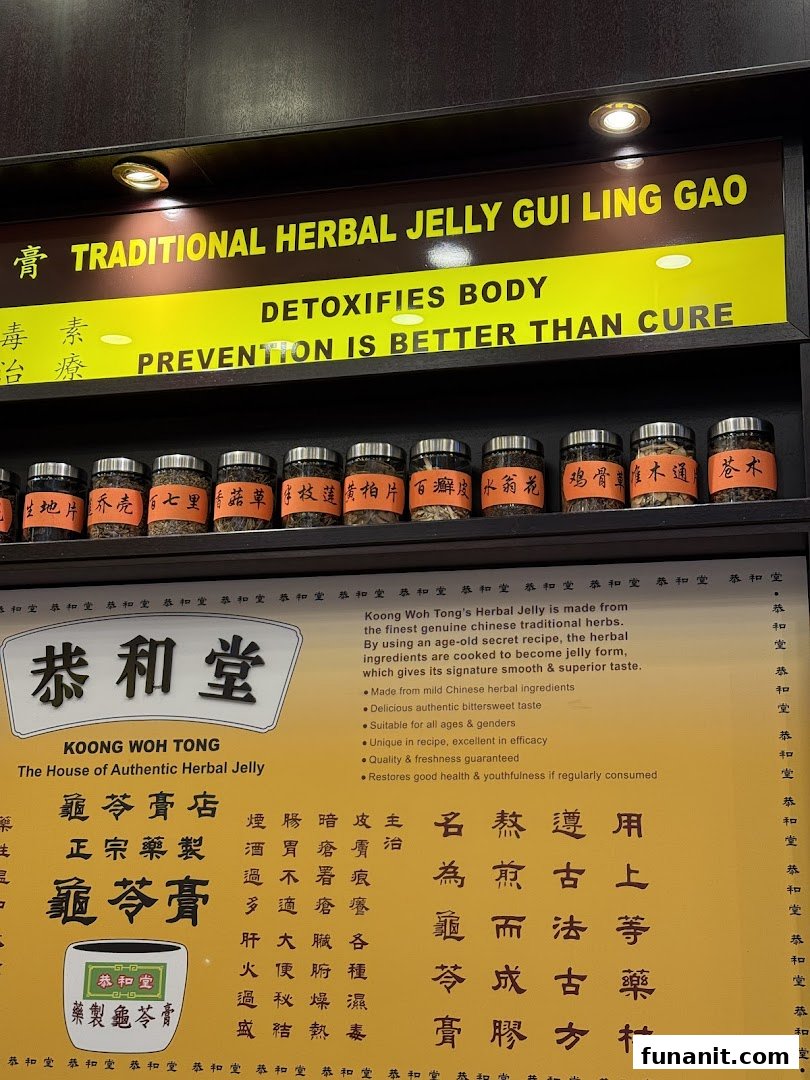 A display showcasing traditional Chinese herbal jelly ingredients and its health benefits at Koong Woh Tong.
