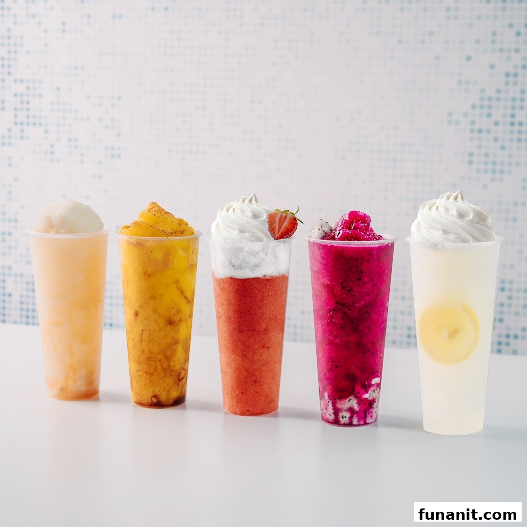 Five vibrant fruit smoothies and lemonades in clear cups with a light background.
