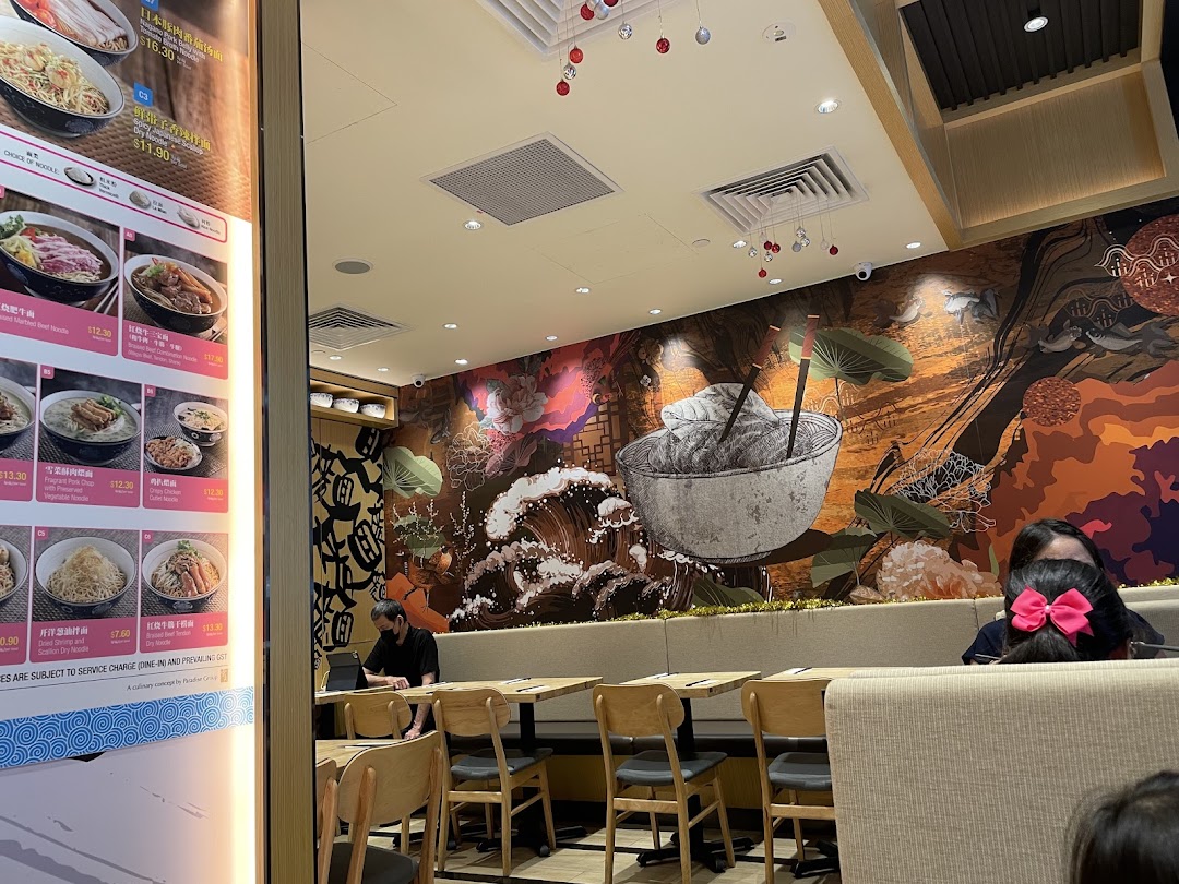 Interior view of LeNu Chefs Wai Noodle Bar, featuring a vibrant wall mural and comfortable seating.