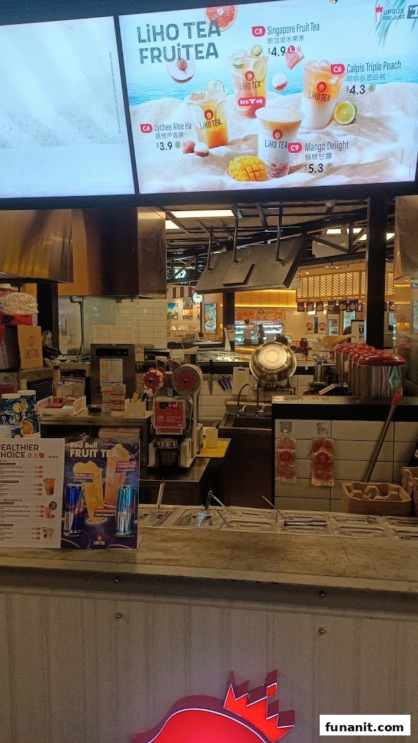 A vibrant LiHO TEA counter with a digital menu displaying refreshing fruit tea options.