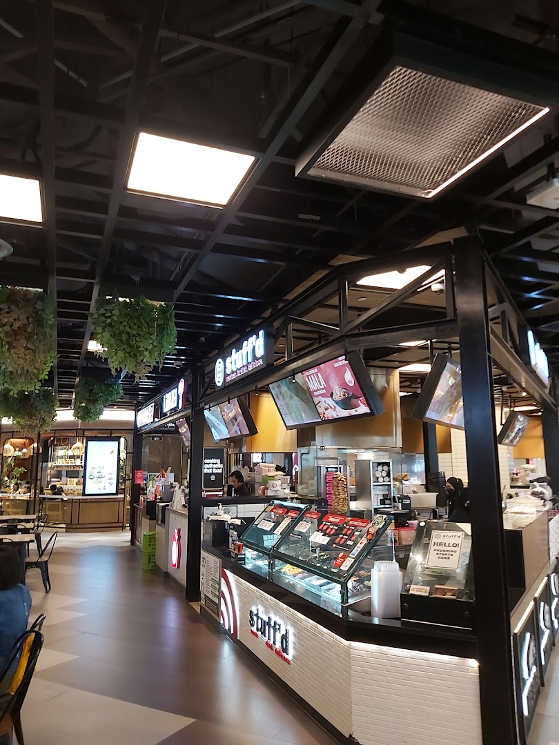 Interior view of a modern food court at Funan Mall, featuring the stuff'd stall and other eateries.