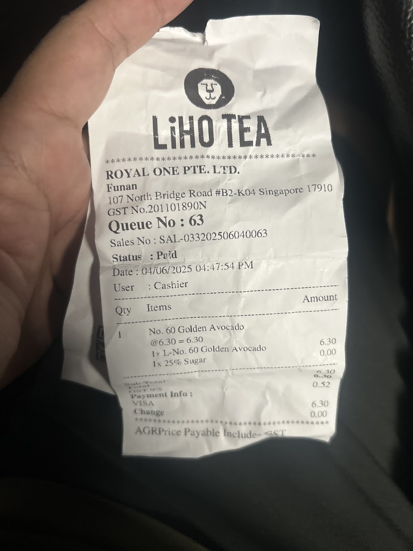 A close-up of a LiHO TEA receipt from Funan Mall showing a Golden Avocado drink purchase.