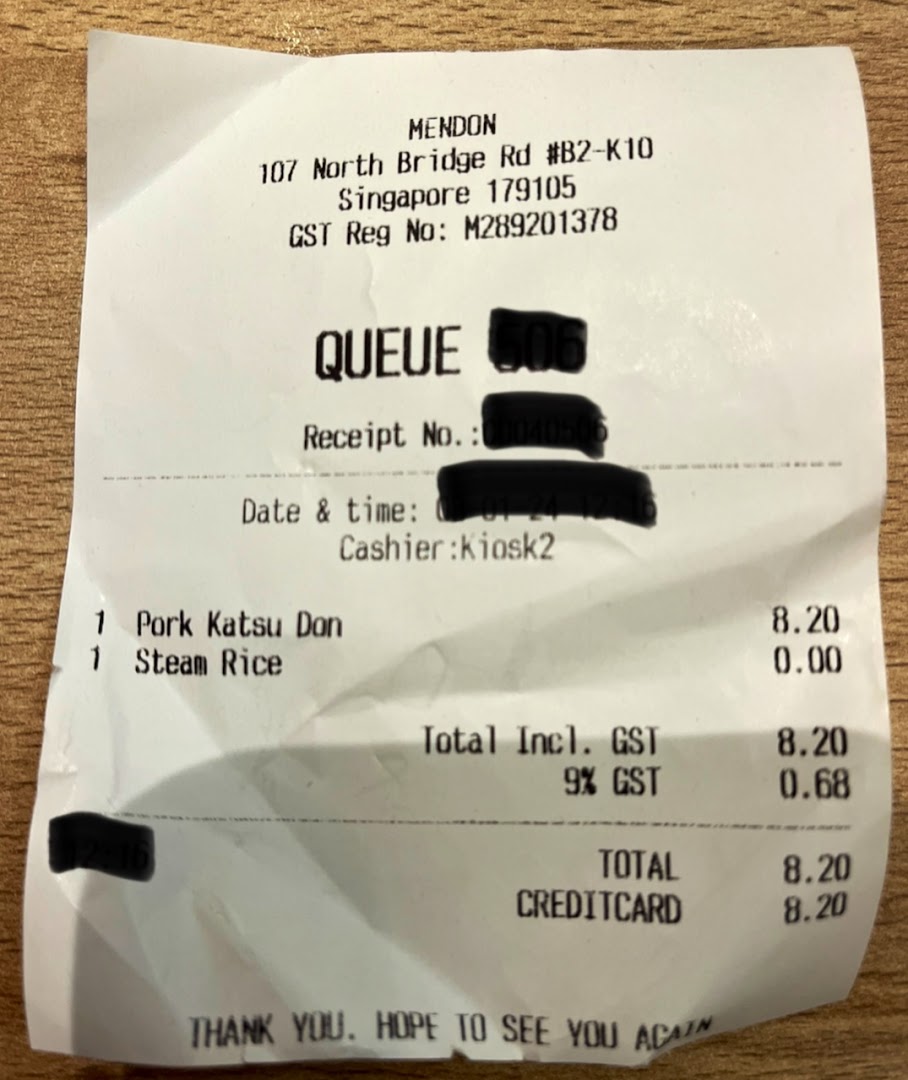 A detailed receipt from Mendon, showing a purchase of Pork Katsu Don and Steam Rice.