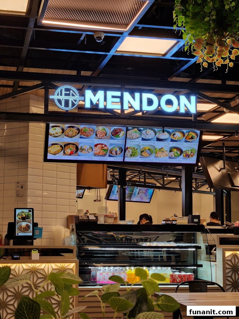 A digital menu board at Mendon showcasing various Japanese-inspired rice bowls and ramen dishes.