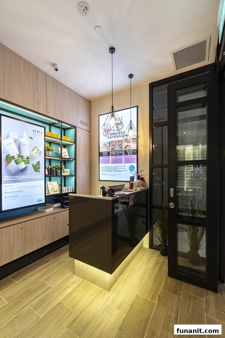 A modern and inviting reception area of Nailz Treats, featuring a sleek counter and product displays.