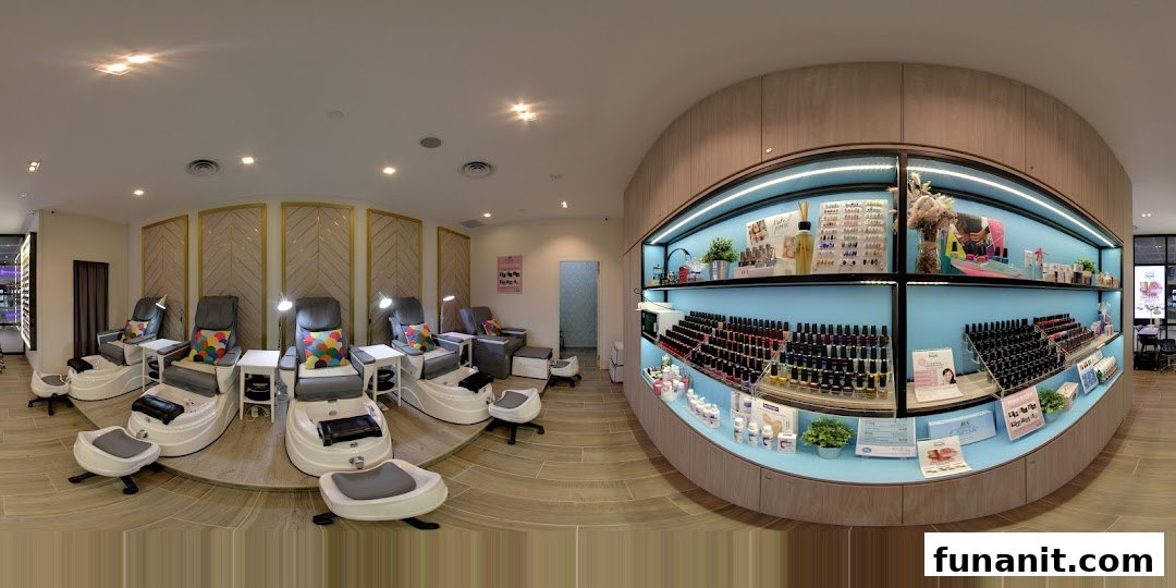 Interior view of a modern nail salon featuring pedicure stations and a vibrant product display.