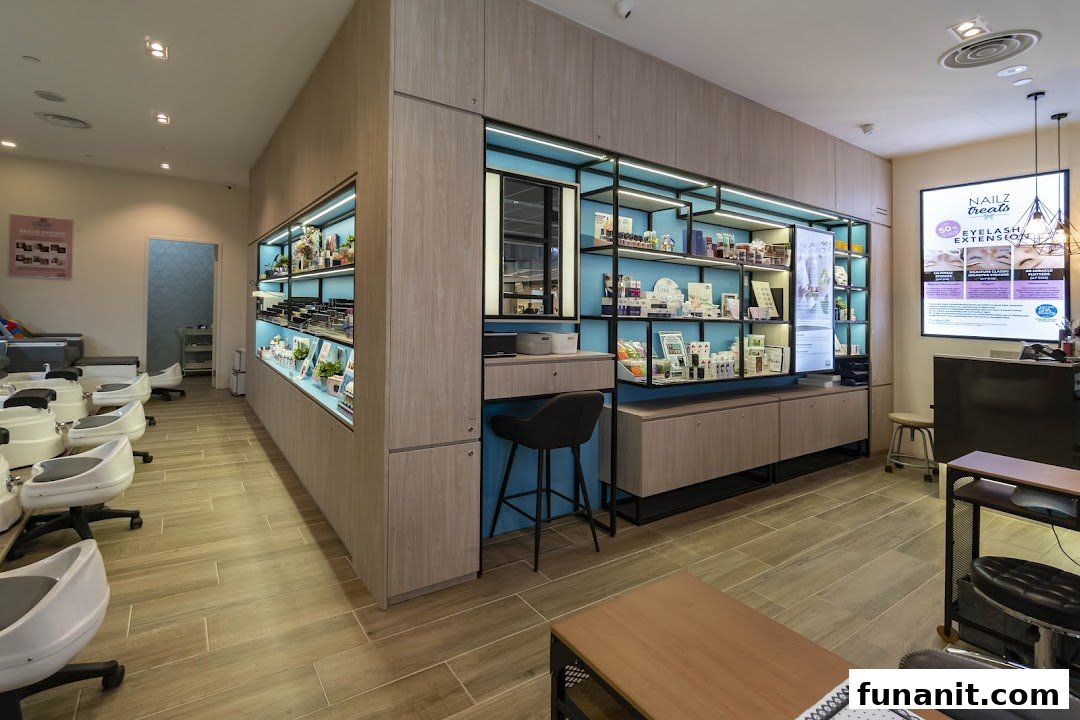 Bright and modern interior of Nailz Treats salon featuring pedicure stations and product display shelves.