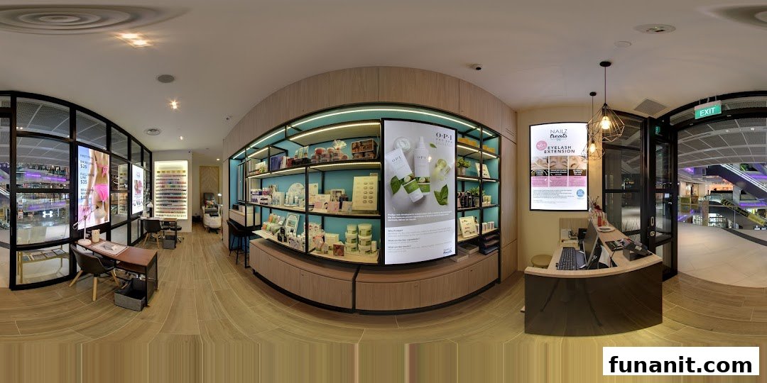 An interior view of Nailz Treats, showcasing the reception, product displays, and nail service stations.