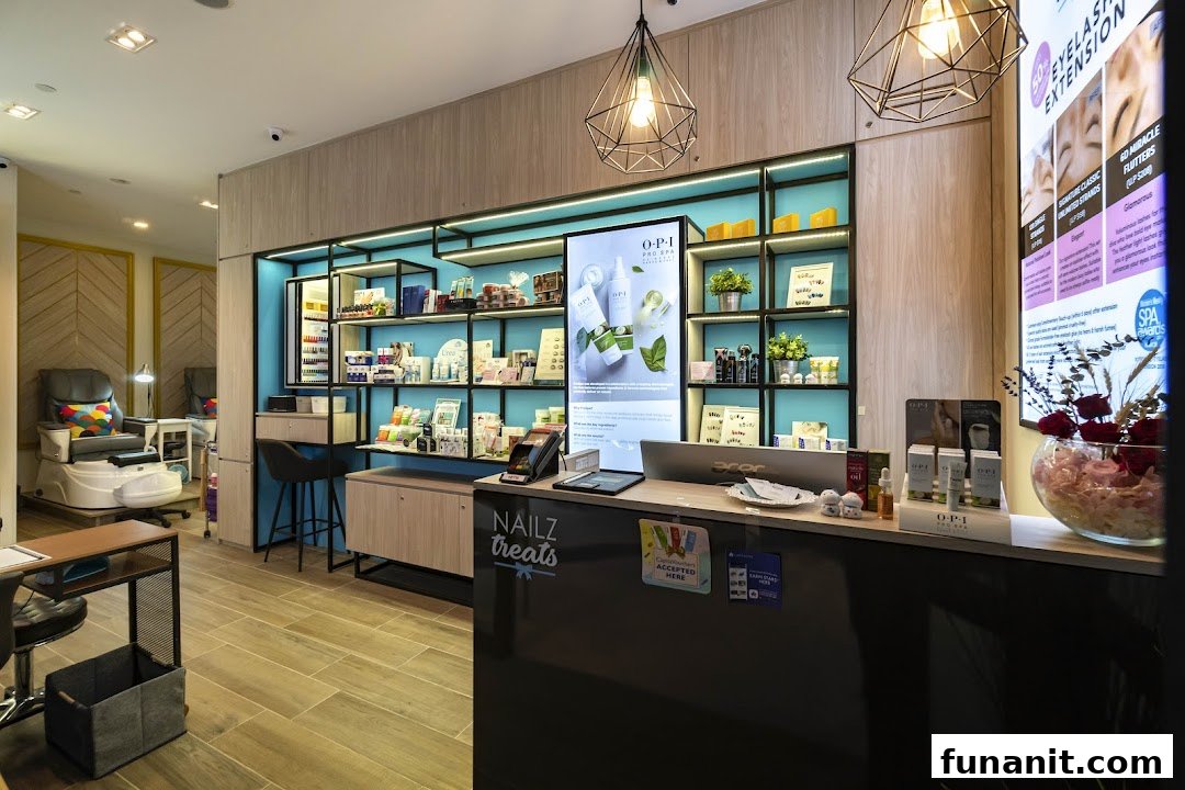 Interior view of Nailz Treats, showcasing the reception, product displays, and a pedicure station.