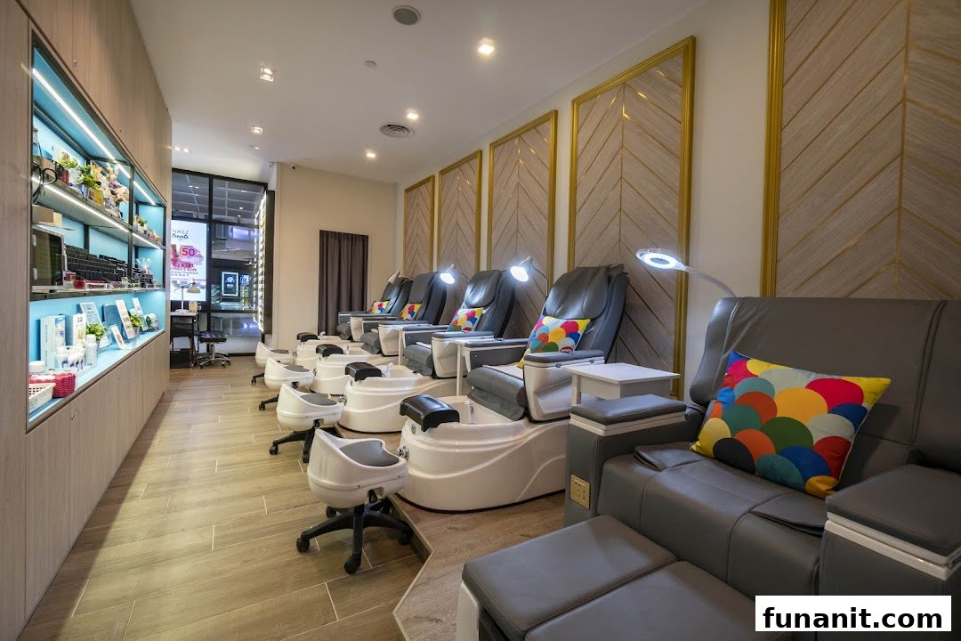 A modern nail salon interior featuring multiple comfortable pedicure stations with colorful cushions.