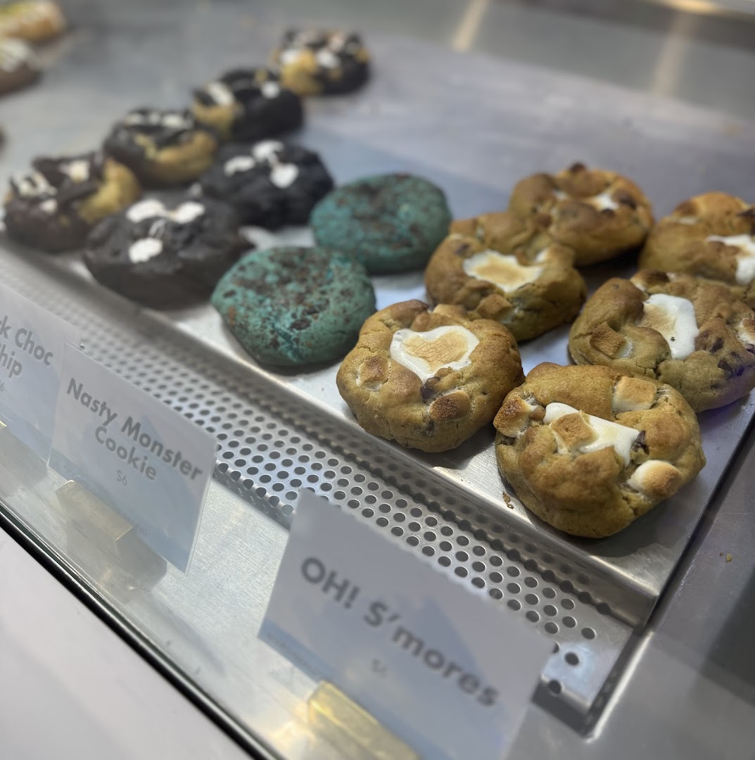 A vibrant display of Nasty Cookie's gourmet cookies, featuring S'mores and Monster varieties.