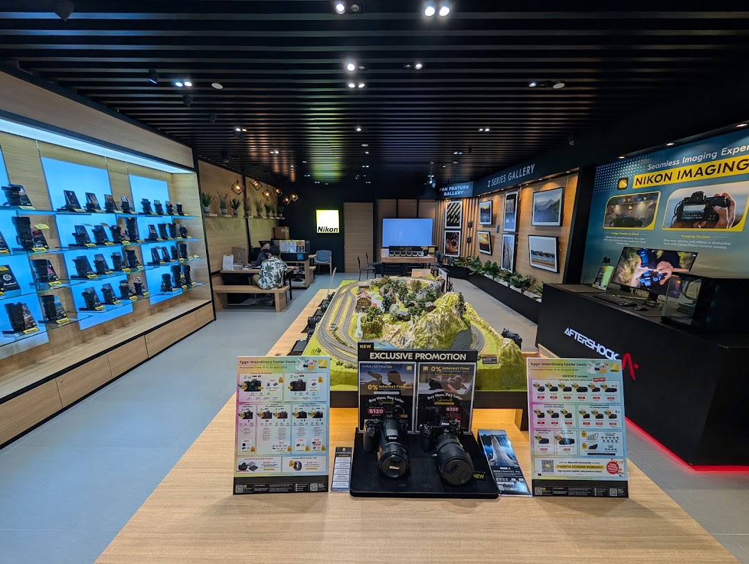 An interior view of the Nikon Experience Hub showcasing cameras, accessories, and interactive displays.