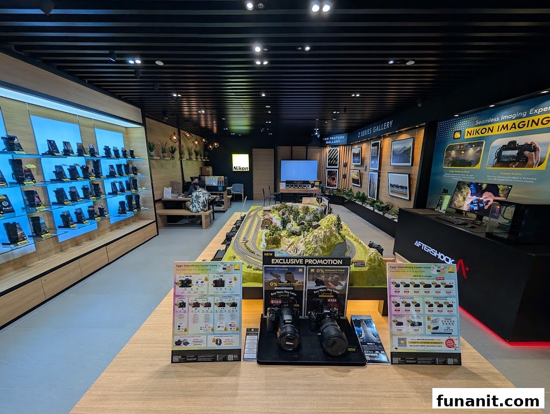 An interior view of the Nikon Experience Hub showcasing cameras, accessories, and interactive displays.