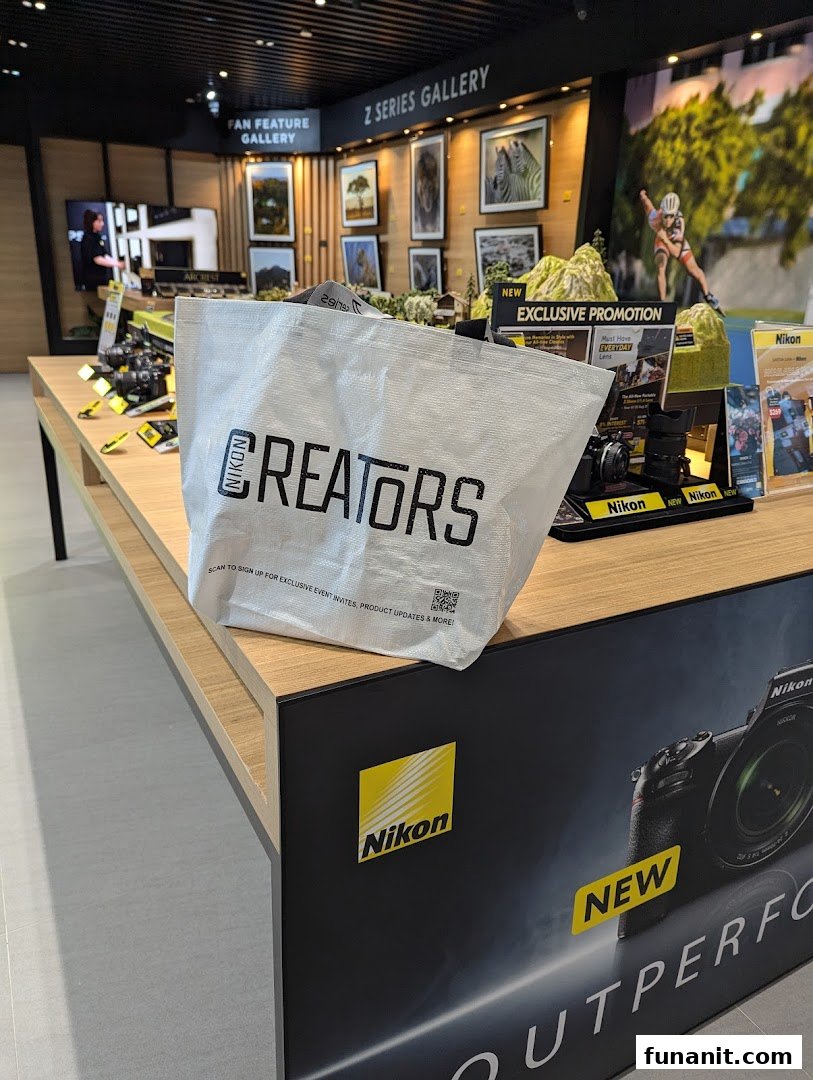 Interior view of Nikon Experience Hub Singapore, showcasing cameras, displays, and a 'Z Series Gallery'.
